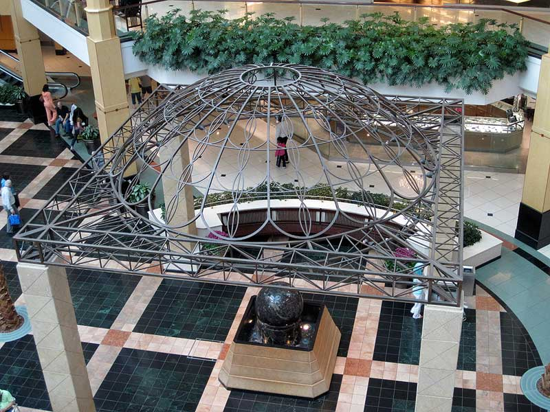 Large wrought iron trellis with a dome shaped top at Somertset mall fabricated by Couturier