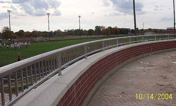Tig welded stainless steel guardrail at low wall athletic field
