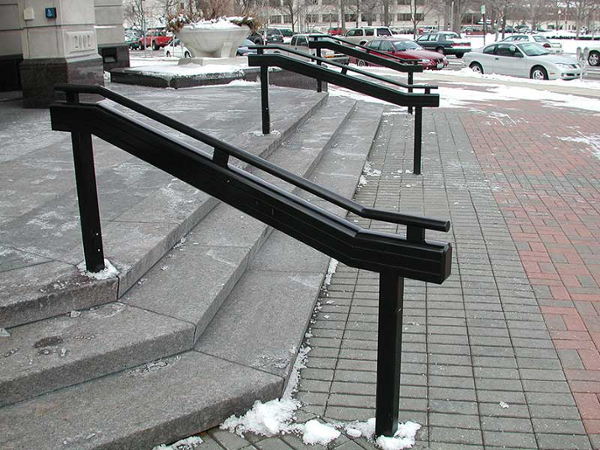 Aluminum hand railings at concrete steps.