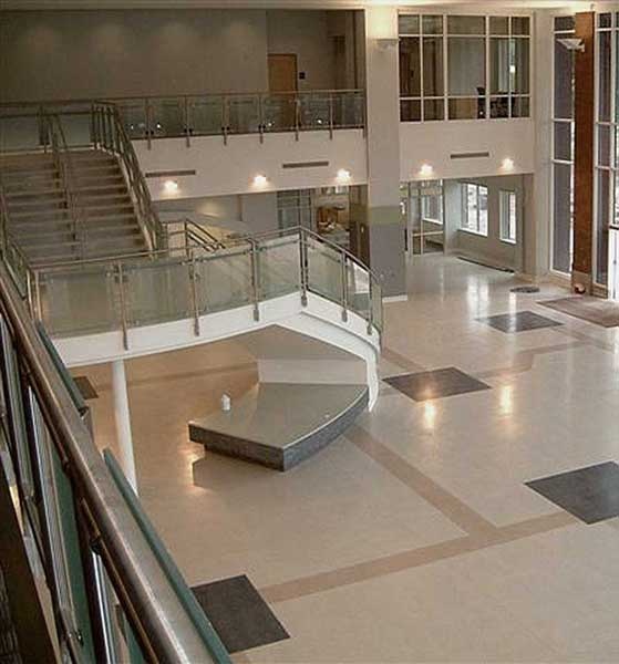 Decorative curved spiral stair with frosted glass railings.