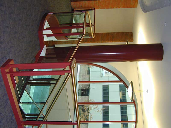 Glass railings with brass cap rail.