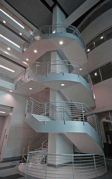 Center column supported multi flight curve stairway at Collier County Courthouse.