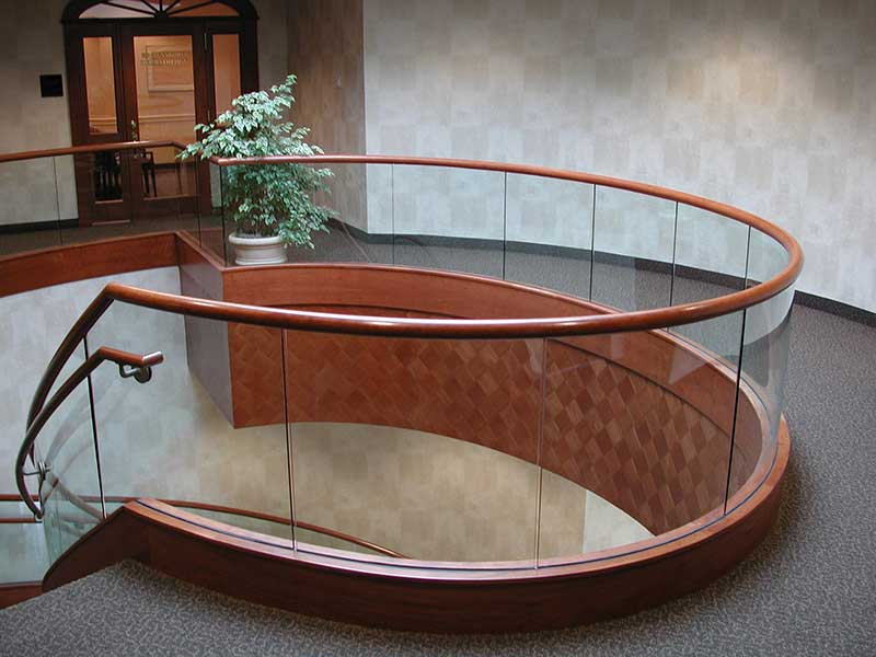 Tempered glass railings at round upper balcony